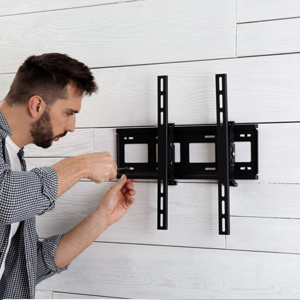 Man installing wall mount bracket